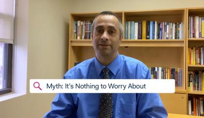 Dr. Simon Rego, Chief Psychologist, sitting in an office discussing the myth that COVID-19 is nothing to worry about.