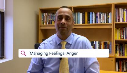 Dr. Simon Rego, Montefiore's Chief Psychologist, sitting in an office discussing feelings of anger toward COVID-19.