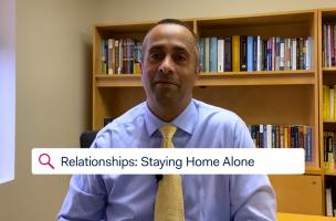 Dr. Simon Rego, Montefiore's Chief Psychologist, sitting in an office discussing staying at home alone during COVID-19.